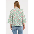 Smith & Quinn bebe top, stylish sleeveless blouse with ruffled neckline and floral print, perfect for casual or semi-formal wear.