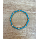 Sm Style bamboo bangle jewelry, natural light-colored wooden bracelet with smooth finish and minimalist design, close-up shot.