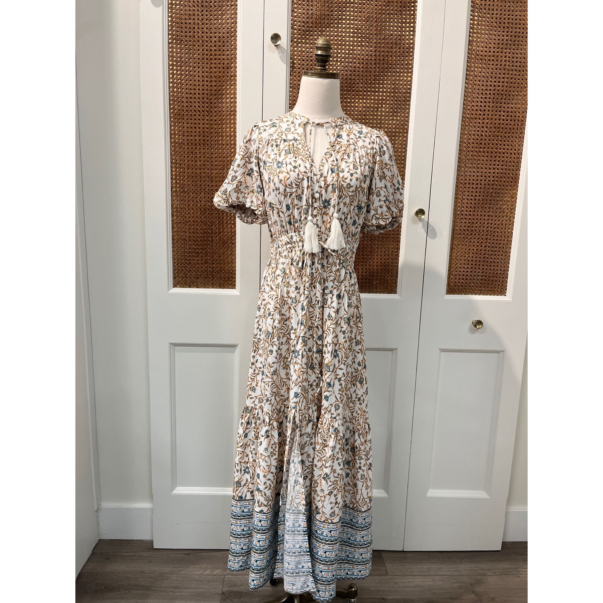 Elan Carina Dress displayed on a hanger, featuring a stylish, flowing design in a soft, elegant fabric suitable for casual or formal wear.
