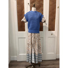 Elan Carina Dress hanging on a hanger, featuring a flowy fabric and elegant design, perfect for casual or semi-formal occasions.