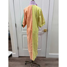 Adrienne Blakely Dress displayed on a hanger, showcasing its elegant fabric and classic design.