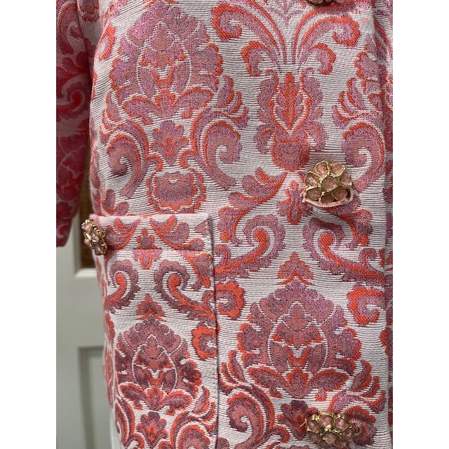 JADE Taylor jacket top in black, featuring a stylish collar and button details, displayed on a hanger against a white background.