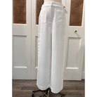 JADE Agnes Pants, stylish women's bottoms with a relaxed fit and neutral color, shown on a model in a casual setting.