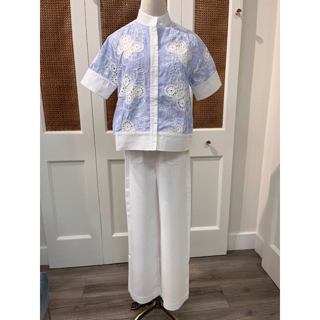 JADE Edna Top, stylish sleeveless blouse in soft fabric with a relaxed fit and subtle detailing, on a neutral background.