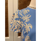 JADE Vera dress displayed on a mannequin, featuring a stylish, flowy design with a V-neck and short sleeves.