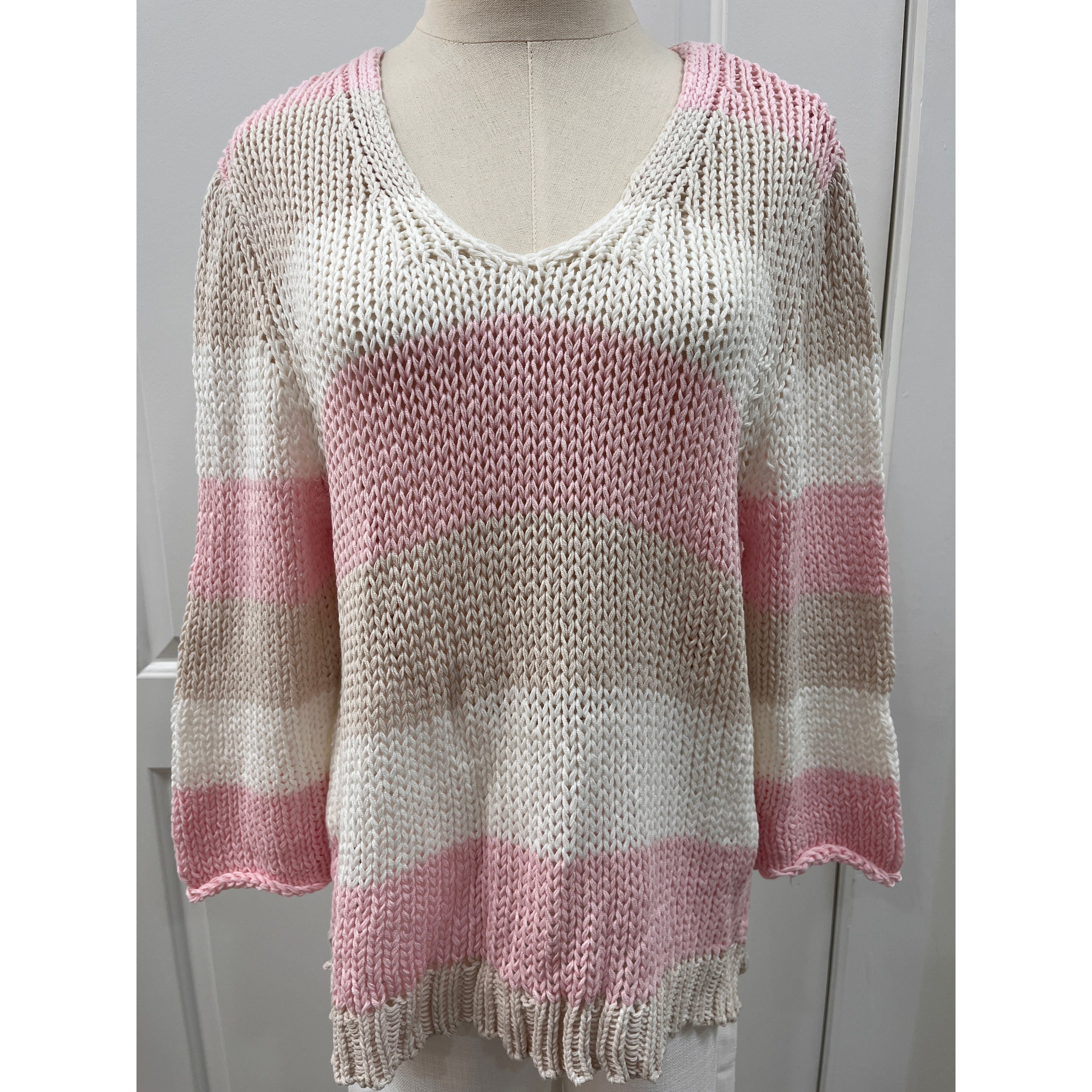 Wooden Ships Hadley sweater top featuring knit fabric, crew neckline, and long sleeves, displayed on a hanger.
