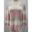 Wooden Ships Hadley sweater top featuring knit fabric, crew neckline, and long sleeves, displayed on a hanger.