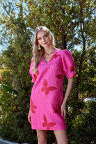 Dolly Dress by Jade — candy pink butterfly jacquard mini dress with puff sleeves and V-neckline, front view1