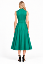 Rosemary Dress by Jade in emerald green, back view with stand collar, fitted waist, and full midi skirt