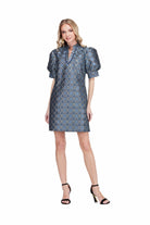  Georgia Dress by Jade in Gilded Trellis, front view, blue and gold metallic trellis jacquard, stand collar V-notch neckline trimmed in navy, puff sleeves, A-line shift silhouette