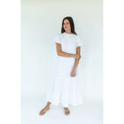 Mary George Gracie Dress, elegant women's dress with floral pattern and sleeveless design, shown on a hanger.
