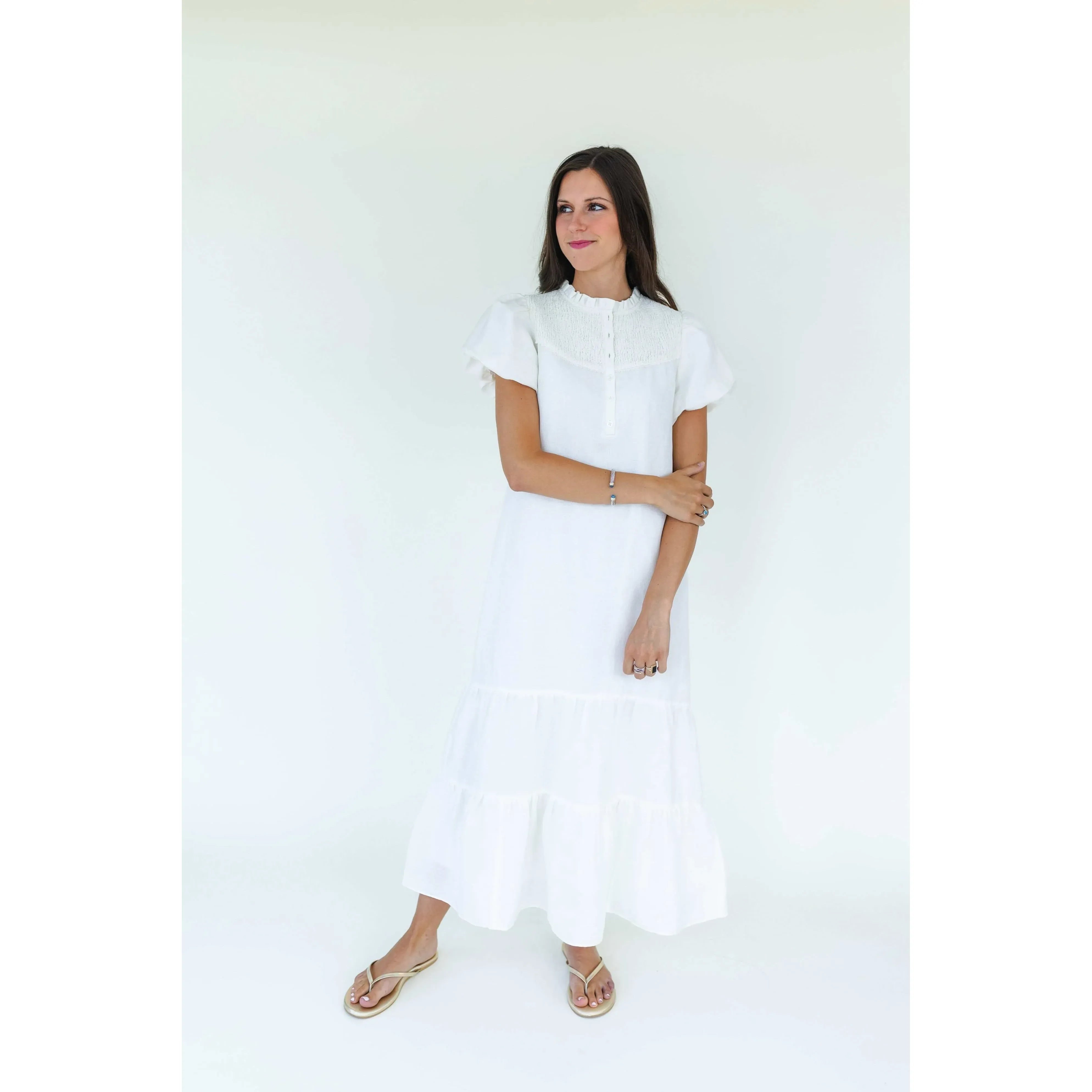 Mary George Gracie Dress, elegant women's dress with floral pattern and sleeveless design, shown on a hanger.