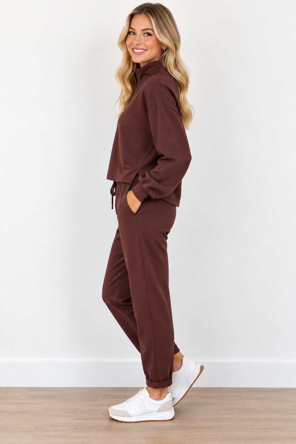 Edie Top by Molly Bracken in chocolate brown with gold-tone half zip, stand collar, and long sleeves, side view