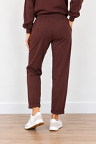 Jackie Pants by Molly Bracken in chocolate brown with drawstring waist, side pockets, and tapered legs, back view