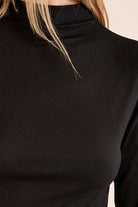  Nancy Top by Molly Bracken in Black, zoom view, fitted mock turtleneck, long sleeves with subtle shoulder ruching, slim silhouette, fine ribbed texture style # EF1662EN