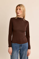 Nancy Top by Molly Bracken in Chocolate Brown, front view, fitted mock turtleneck, long sleeves with subtle shoulder ruching, slim silhouette, fine ribbed texture Style # EF1662EN