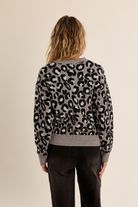 Charlotte Sweater by Molly Bracken in grey leopard print knit with ribbed crew neck, cuffs and hem, back view