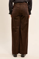 Finley Trousers by Molly Bracken in brown satin animal print, high waist with back patch pockets, back view