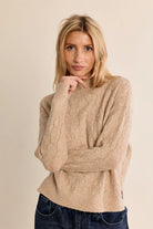 Avery Sweater by Molly Bracken in golden beige openwork knit with high collar and ribbed trims, front view