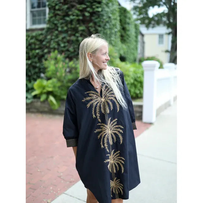 Navy Bleu Campbell dress in black with palm tree pattern, sleeveless design, and V-neck, perfect for casual or summer wear.