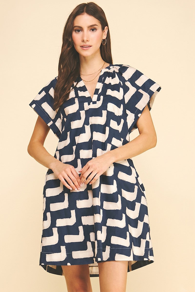 Frances Dress by Pinch in navy geometric print, V-neck mini with cap sleeves and shirred bodice