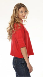 Aria Sweater Red by Rain & Rose — red mock neck sweater with pleated elbow sleeves, side view