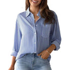 Antonia Top by Rosa Clothing blue striped button-front top with chest pocket, long sleeves, collared neckline, lifestyle shot

