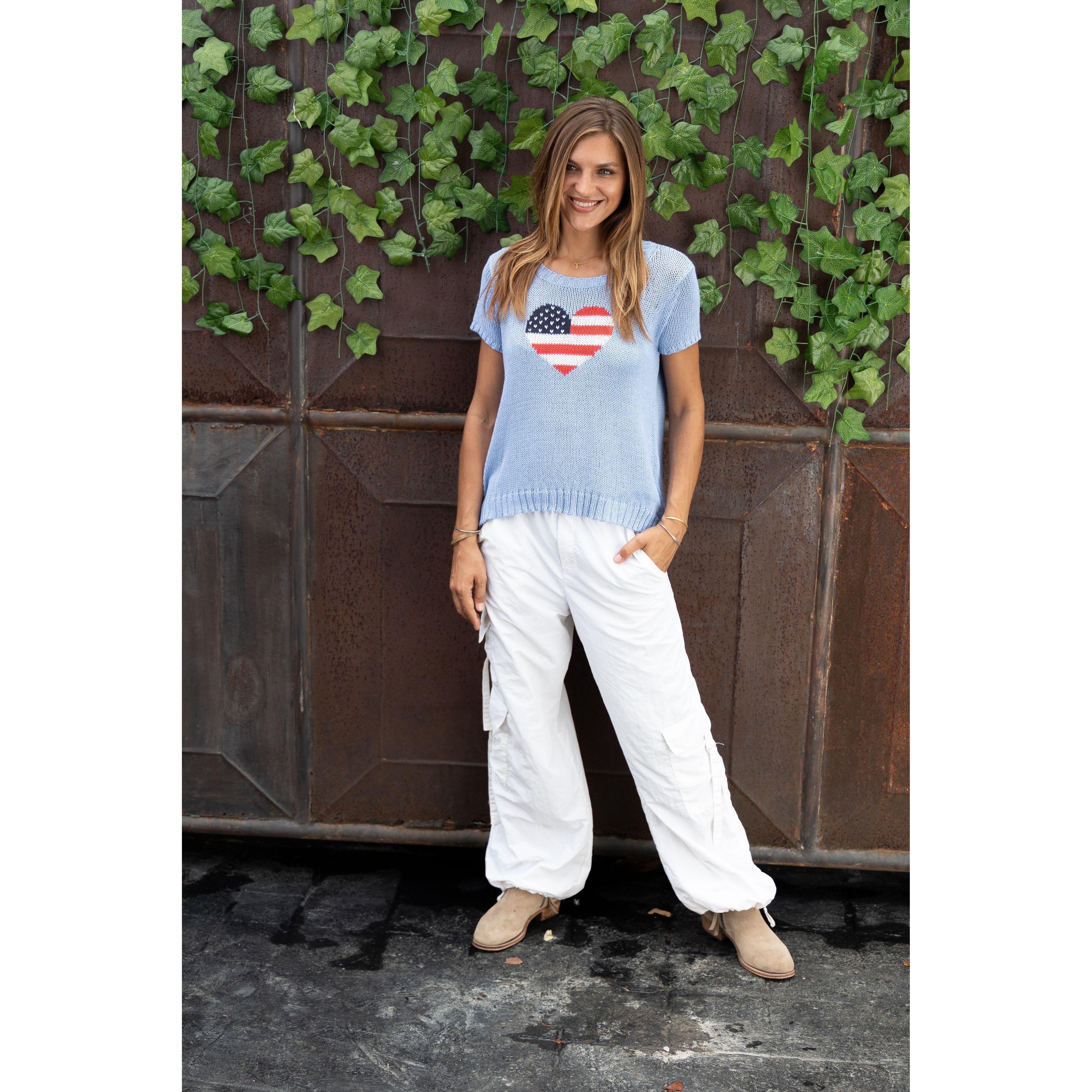 Wooden Ships mini flag heart sweater top in beach sky blue, featuring a small flag and heart design on soft fabric.