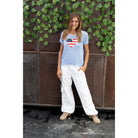 Wooden Ships mini flag heart sweater top in beach sky blue, featuring a small flag and heart design on soft fabric.