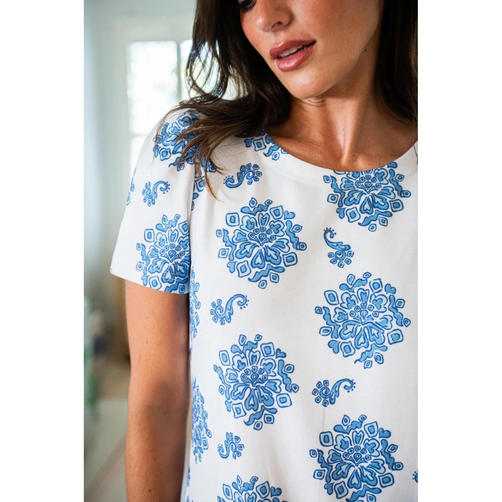 Love Bouquet Sail to Sable dress featuring a floral print, sleeveless design, and a fitted waist on a model.