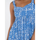 Emily McCarthy Capri dress featuring a stylish design with detailed fabric and elegant fit, perfect for warm weather.