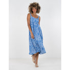 Emily McCarthy Capri dress featuring a stylish, flowy design with a vibrant print, perfect for warm weather and casual outings.