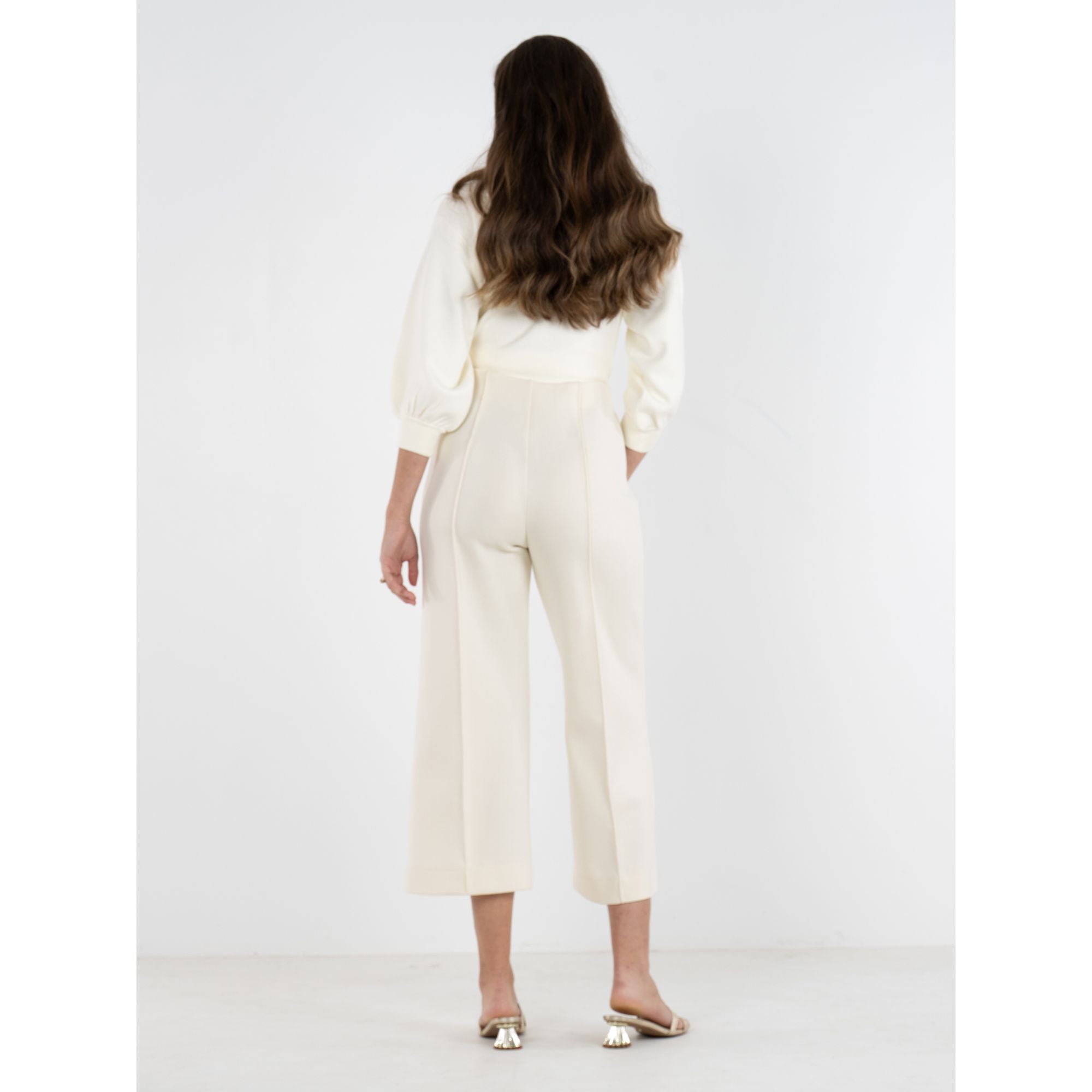 Back view of Emily McCarthy Luna Pants, stylish cropped bottoms with a tailored fit and subtle design details.