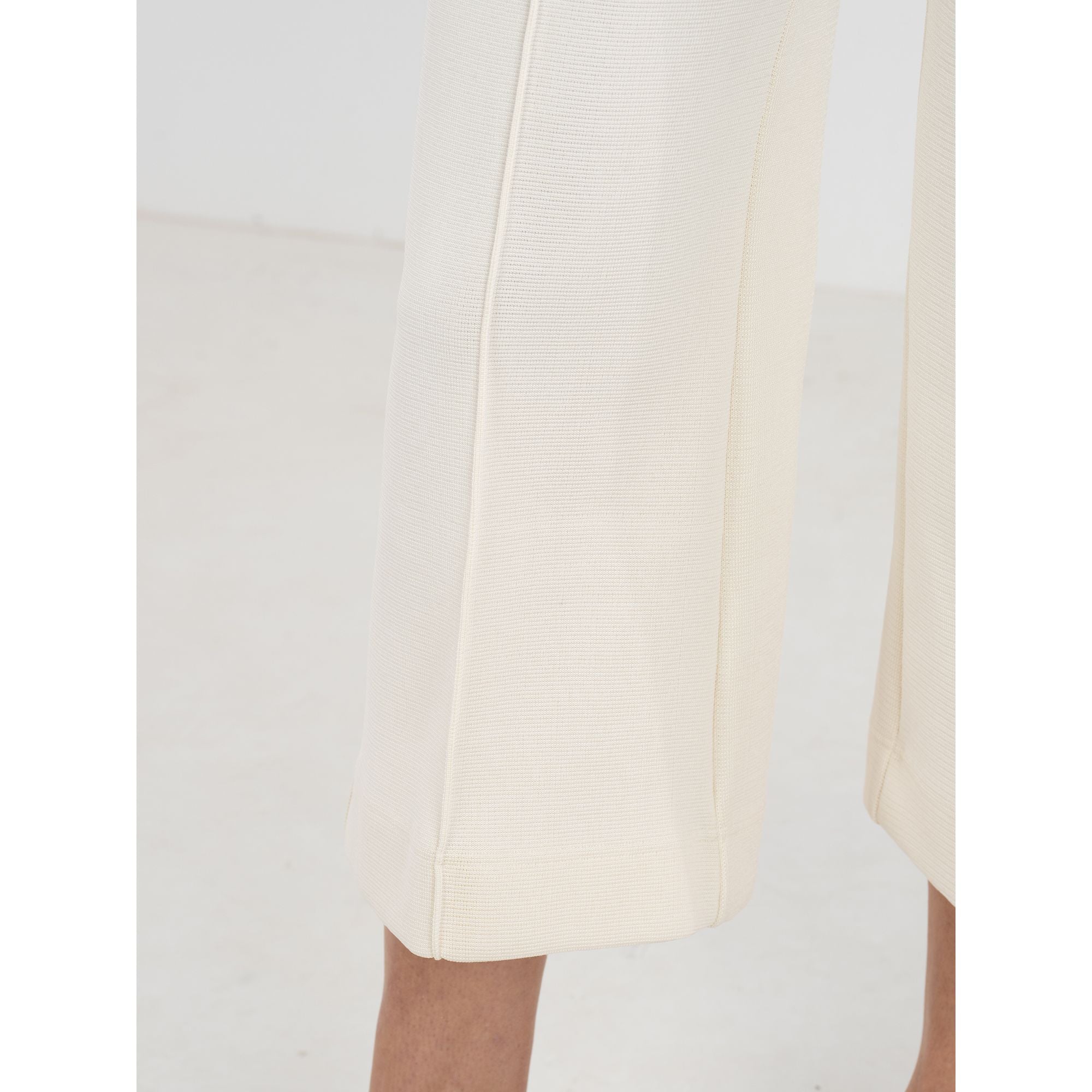 Close-up of Emily McCarthy Luna pants showing detailed embroidery on the stylish bottoms.