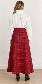 Holly Skirt by Sail to Sable in red and green plaid with a wide waistband and flared ankle-length silhouette, back view