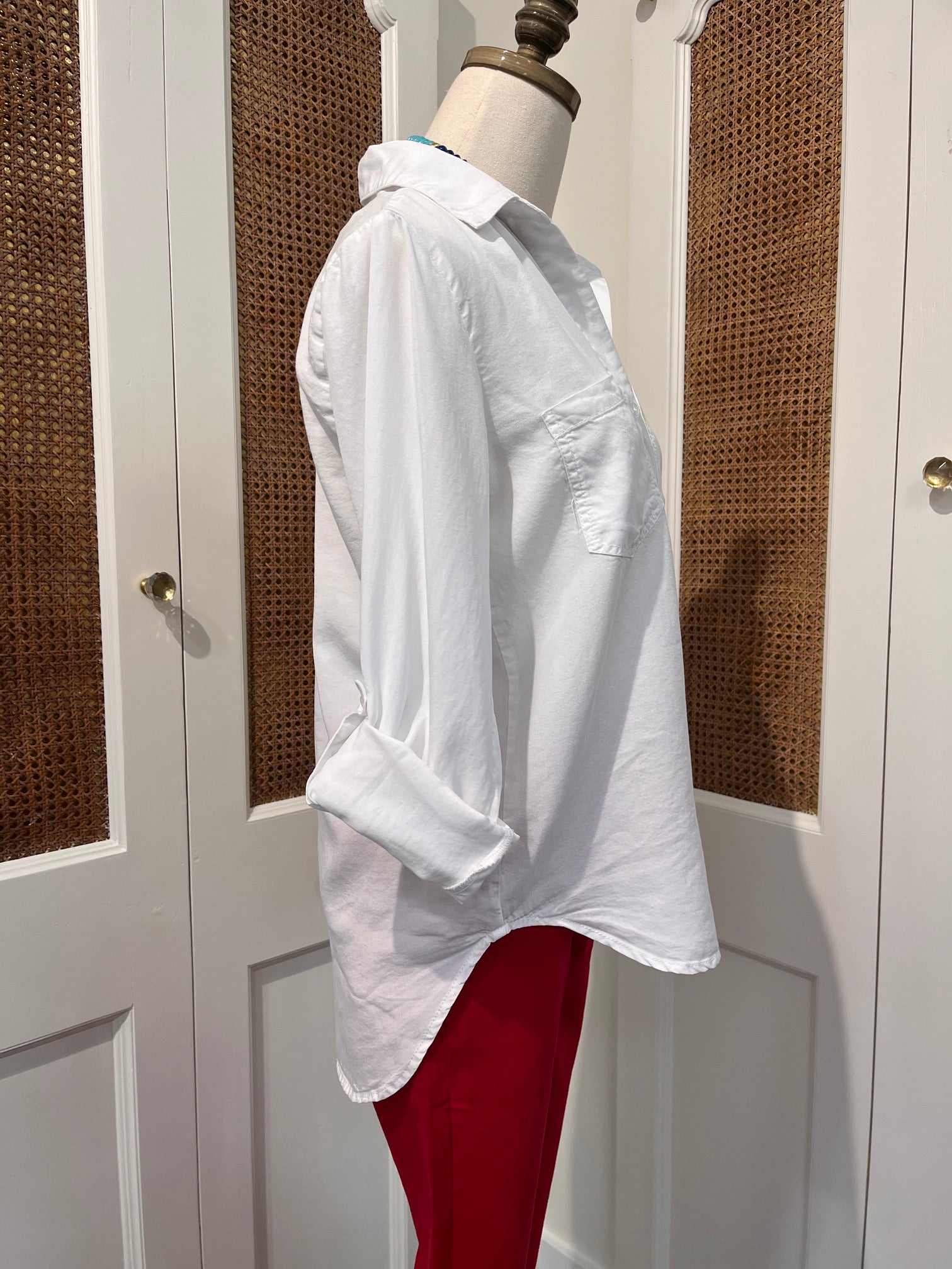 Sirena Top by Velvet Heart — side view of white Tencel button-front shirt with rolled tab sleeves and high-low shirttail hem