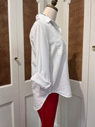 Sirena Top by Velvet Heart — side view of white Tencel button-front shirt with rolled tab sleeves and high-low shirttail hem
