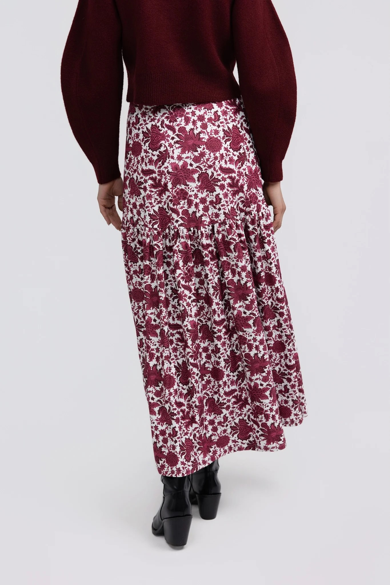 Faye Skirt by Smith & Quinn in raspberry floral print, with a smooth upper panel and gathered lower tier, back view
