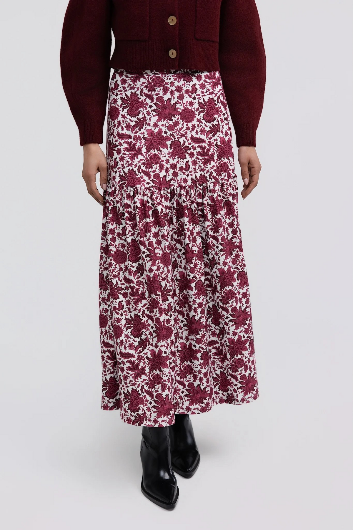 Faye Skirt by Smith & Quinn in raspberry floral print, with a smooth upper panel and gathered maxi skirt, front view