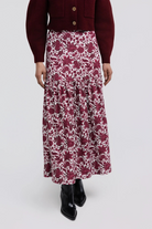 Faye Skirt by Smith & Quinn in raspberry floral print, with a smooth upper panel and gathered maxi skirt, front view