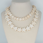 Star Necklace Large Coconut by Smith and Co. Design — coconut cream malachite star beads on bust form, layered
