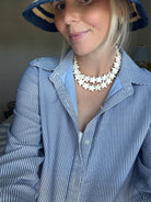 Star Necklace Large Coconut by Smith and Co. Design — coconut cream star bead necklace layered on model
