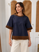 THML Isla Top in dark denim with brown corduroy trim at neckline, sleeves, and hem, front view, boxy fit  style # JH2556