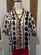 Julia Top by THML — black and white geometric print, smocked neckline, short puff sleeves, front view FTM3126-3