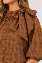 Close-up of brown and khaki stripe and cuff on black Keely Top by THML, Style #WCT4031
