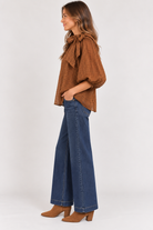 Side view of black Keely Top by THML with brown and khaki striped sleeves, Style #WCT4031