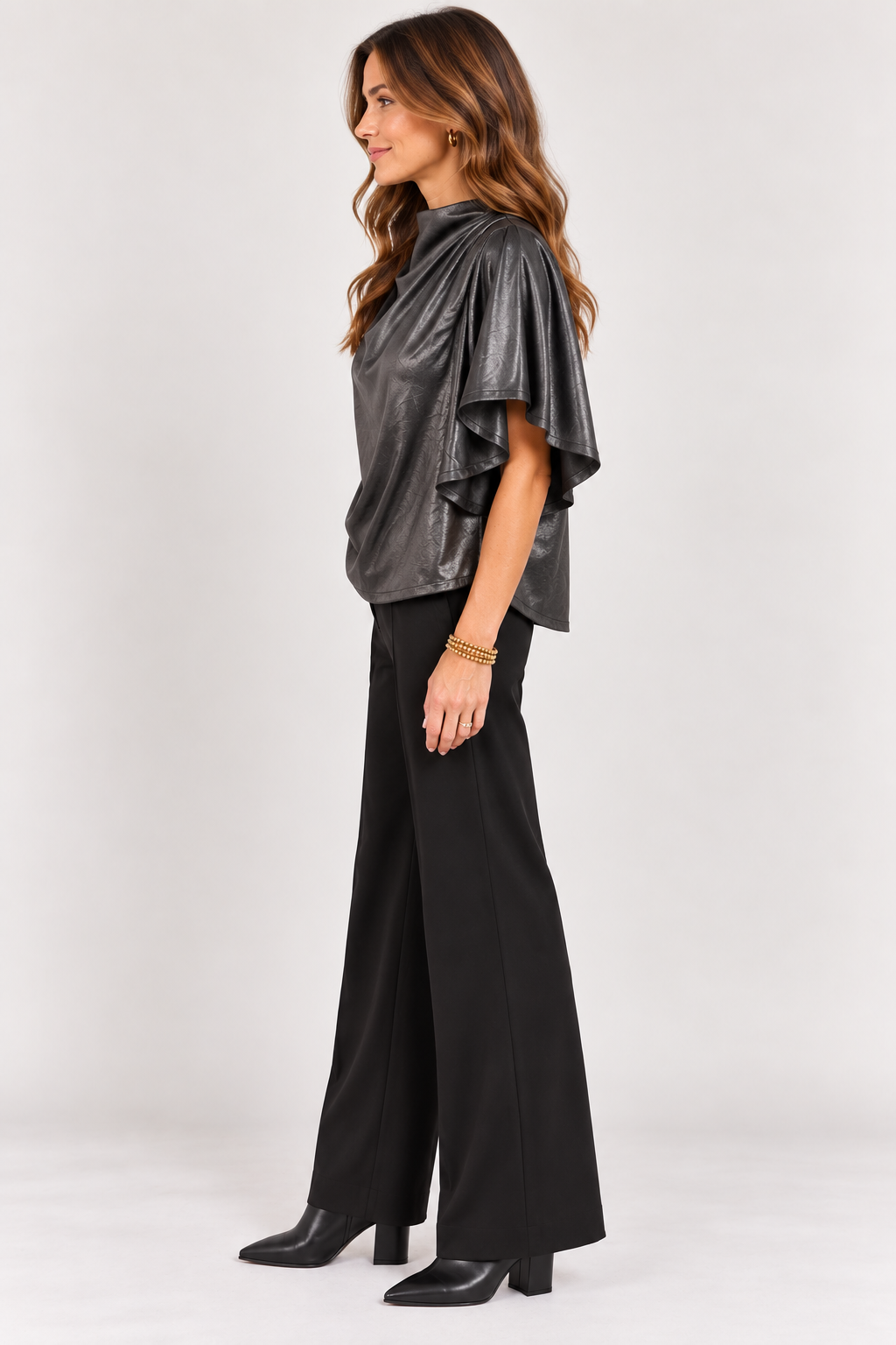 Side view of black Veronica Top showing the draped silhouette and flowy sleeves, Style #WCT4008-1