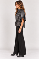 Side view of black Veronica Top showing the draped silhouette and flowy sleeves, Style #WCT4008-1