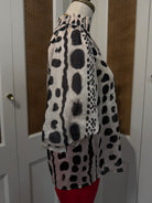 Julia Top by THML — black and white geometric print, smocked neckline, short puff sleeves, side view FTM3126-3