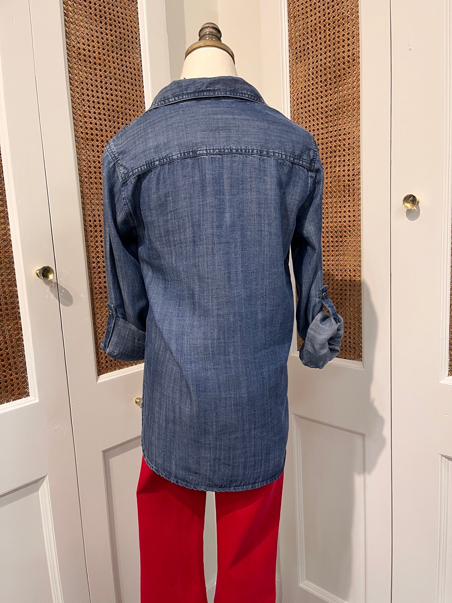 Talma Top by Velvet Heart — back view of medium wash denim button-front shirt with spread collar and rolled tab sleeves